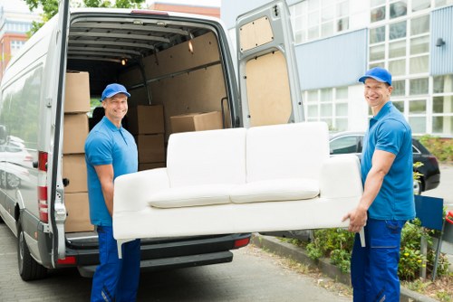 Professional movers handling furniture in Storage Barnes