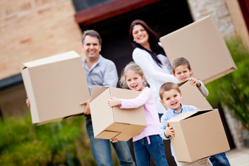Movers packing boxes meticulously