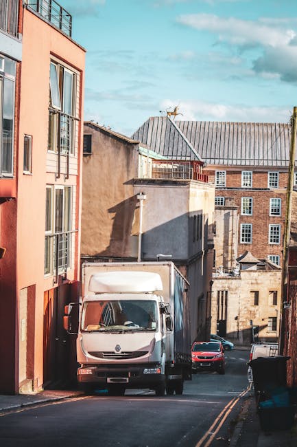 A row of historic terraced houses on Church Road, constructed of grey stone with white window frames and chimneys, is visible in the image. The houses are three stories tall and feature gabled roofs,