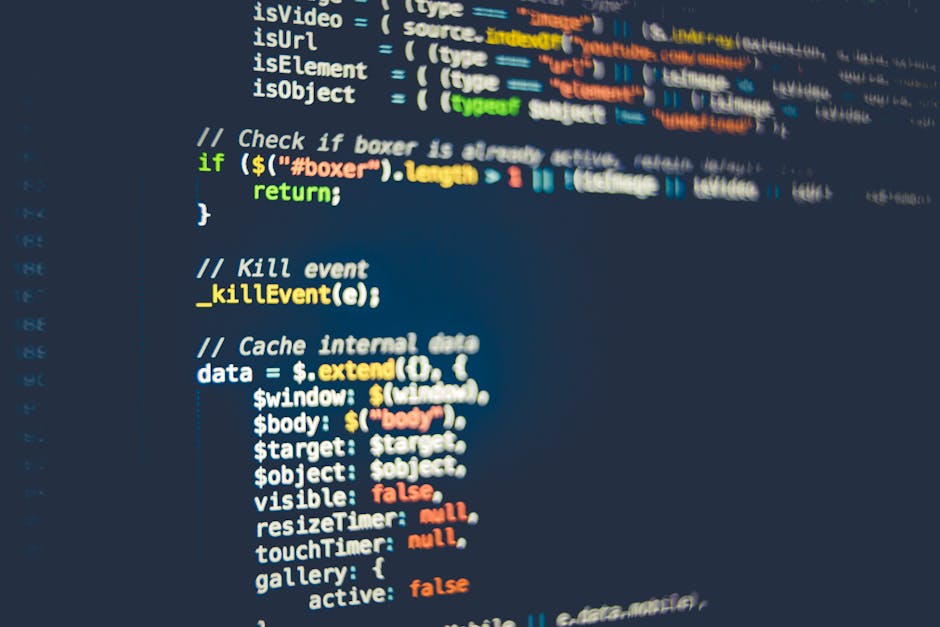 A close-up photograph of a computer screen displaying lines of CSS code in a text editor. The code features various selectors and properties in different colours such as orange, yellow, and white, inc